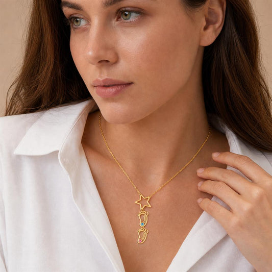 Woman wearing a baby feet star necklace