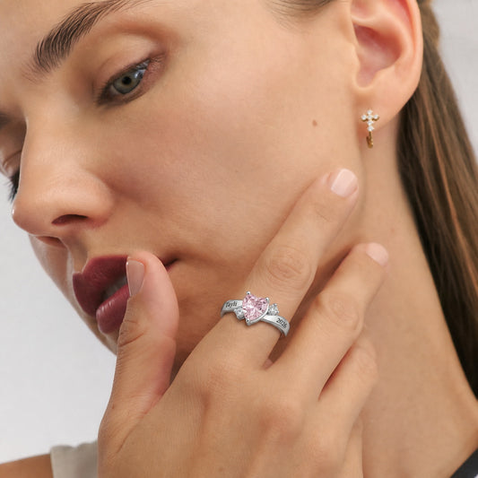 Custom heart birthstone name and date ring worn on hand