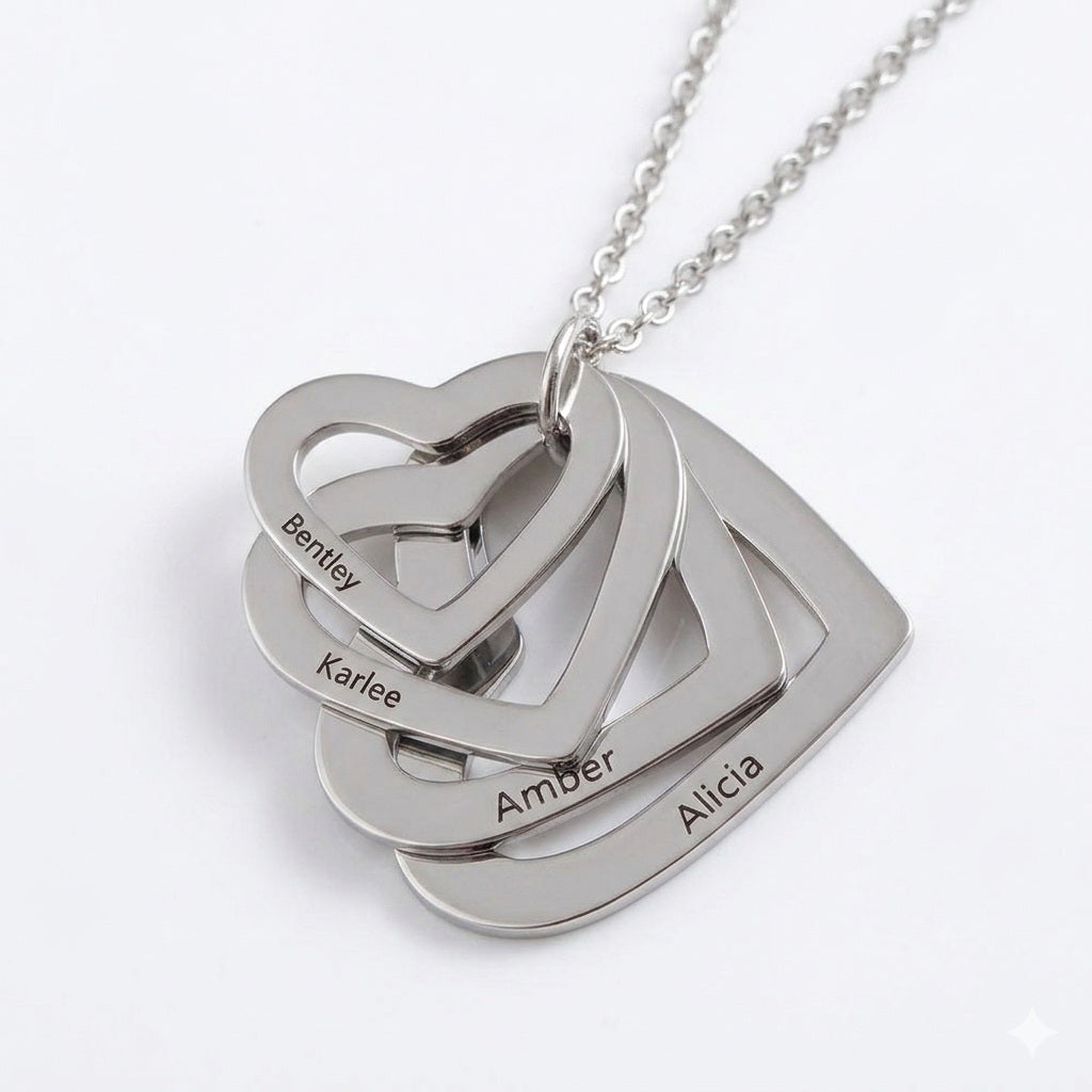 Silver heart necklace with four personalized family names.