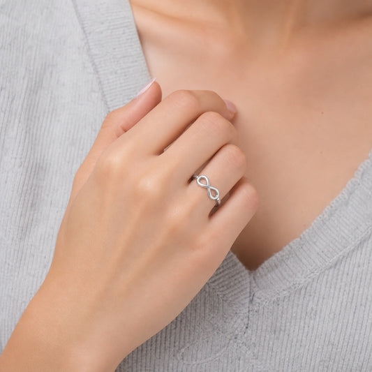 Custom infinity engraved name ring on hand