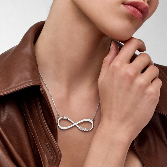Woman wearing a personalized sterling silver infinity necklace.