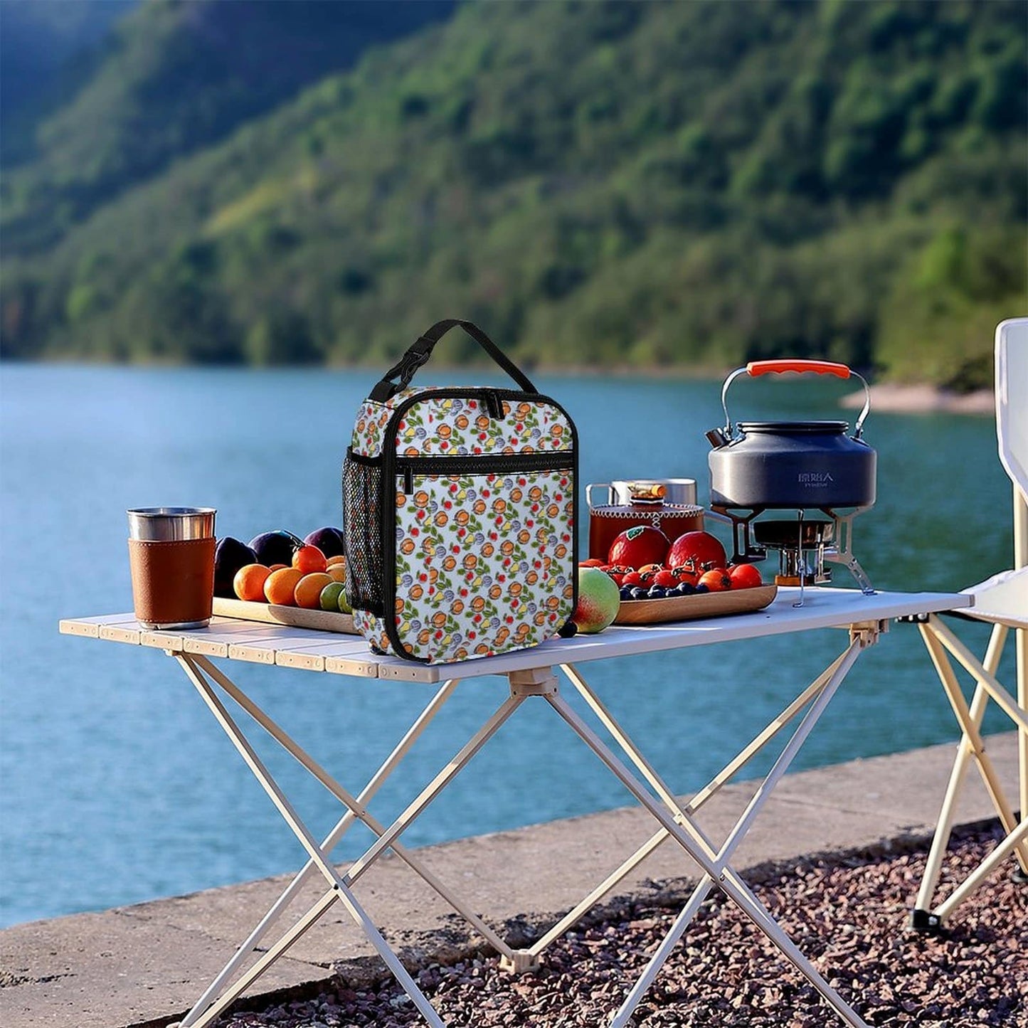 Custom Office Lunch Bag shown on an outdoor table setting by a lake.