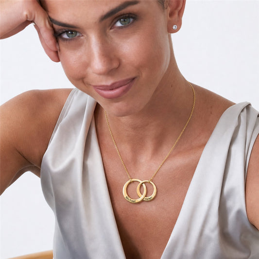 Woman wearing a custom two-name rings necklace