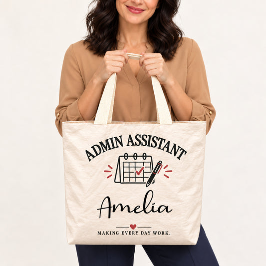 Cream Admin Assistant tote personalized with Amelia, shown close up with the custom name and printed artwork visible.