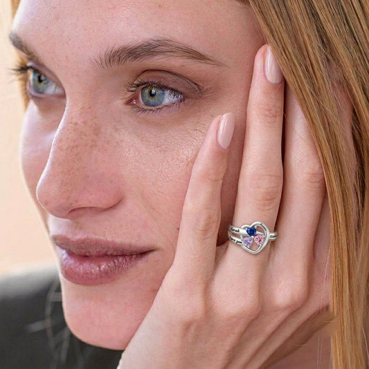 Custom winged heart birthstone name ring on hand jewelry vie