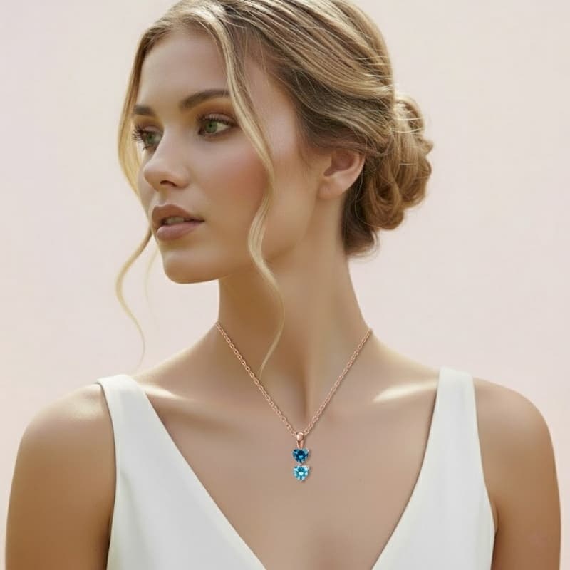 Model wearing the custom heart birthstone necklace, showing the size and fit.