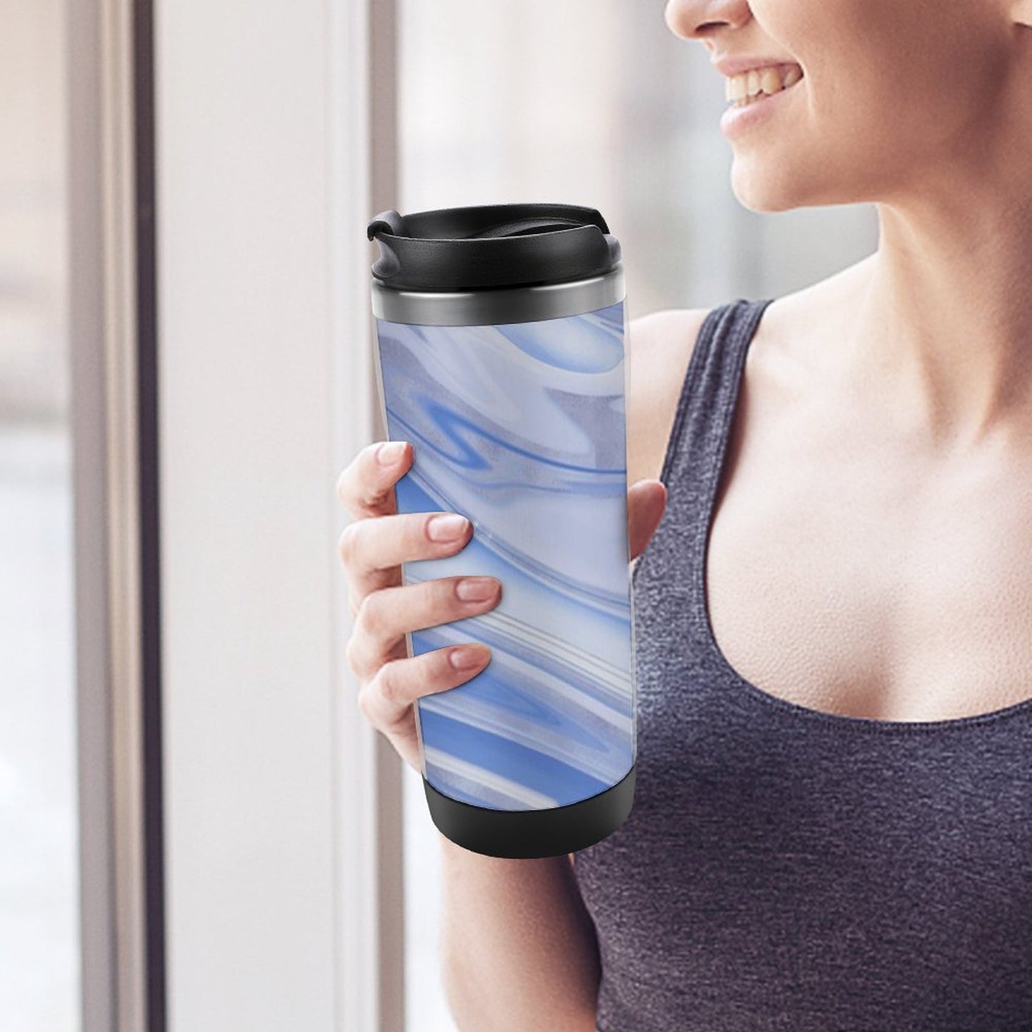 Woman holding custom 12.5oz insulated stainless steel travel coffee mug.