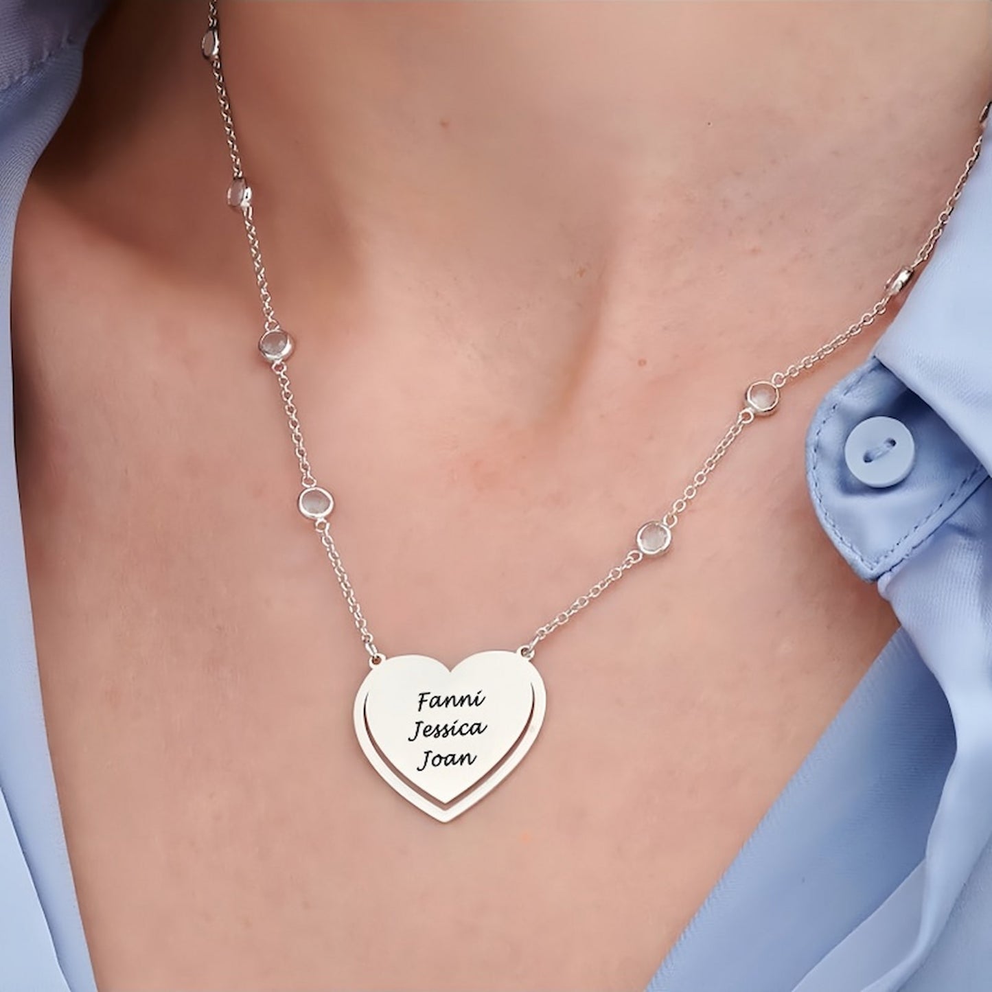 Woman wearing personalized sterling silver heart name necklace, ideal gift for her.