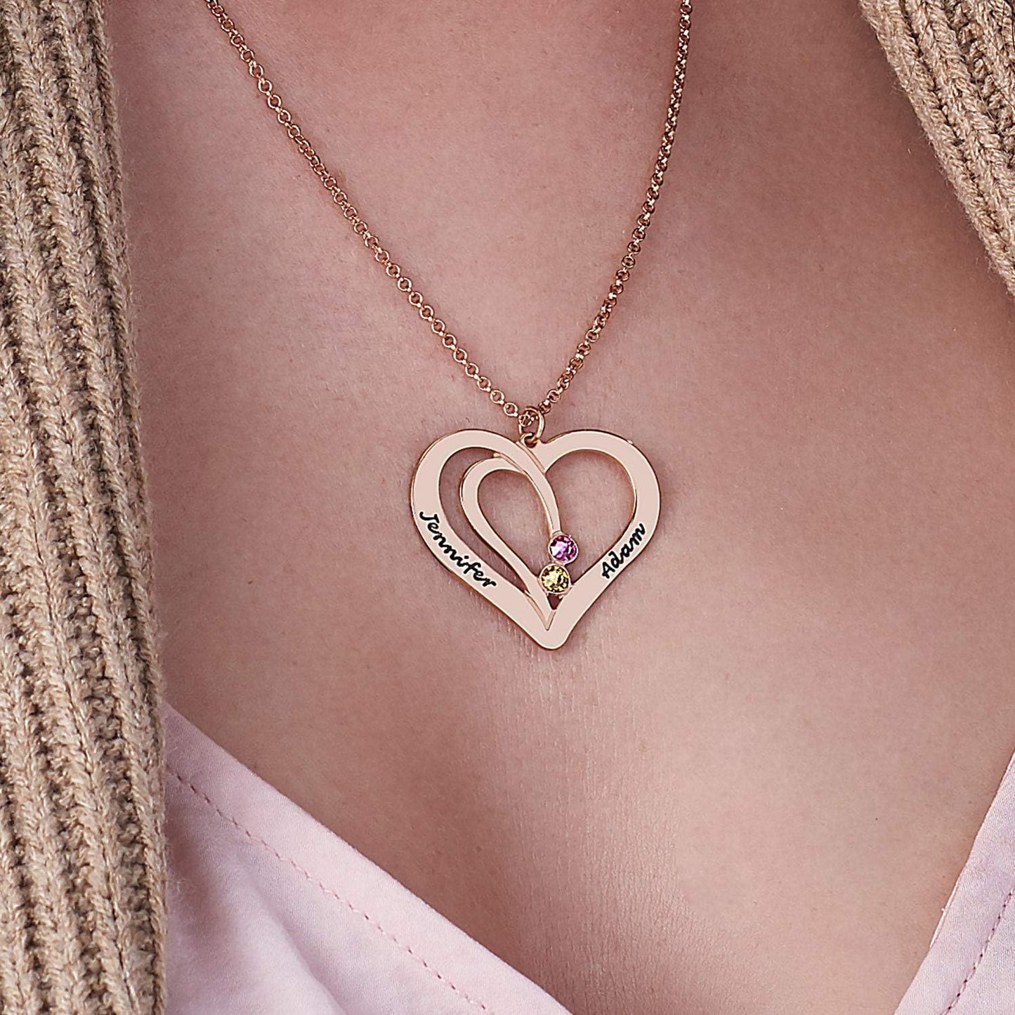 Woman wearing Rose Gold Personalized Couple Heart Necklace with 2 Birthstones. Custom gift.