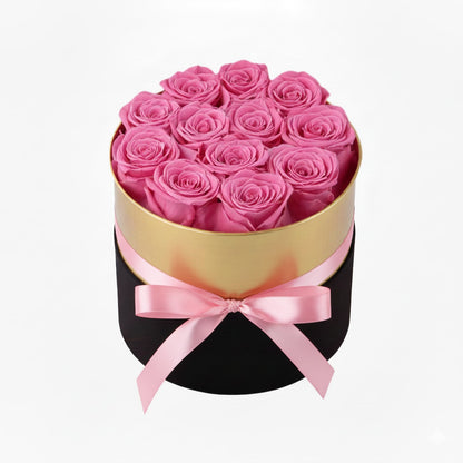 Design luxury 12 pink preserved roses in a black and gold box. Long lasting romantic gift.