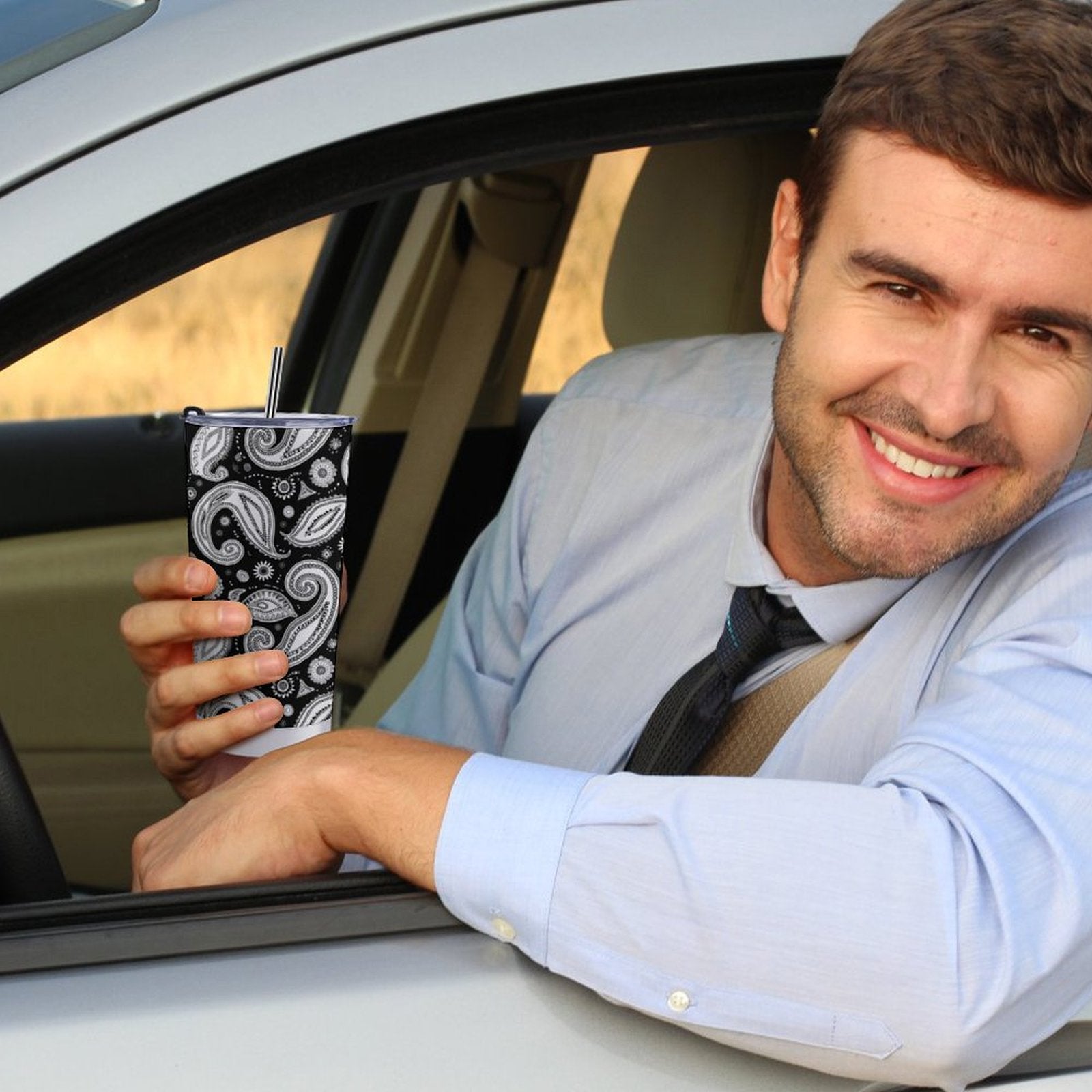 20oz Tumbler with Custom Logo held in hand, showing ergonomic grip and size.