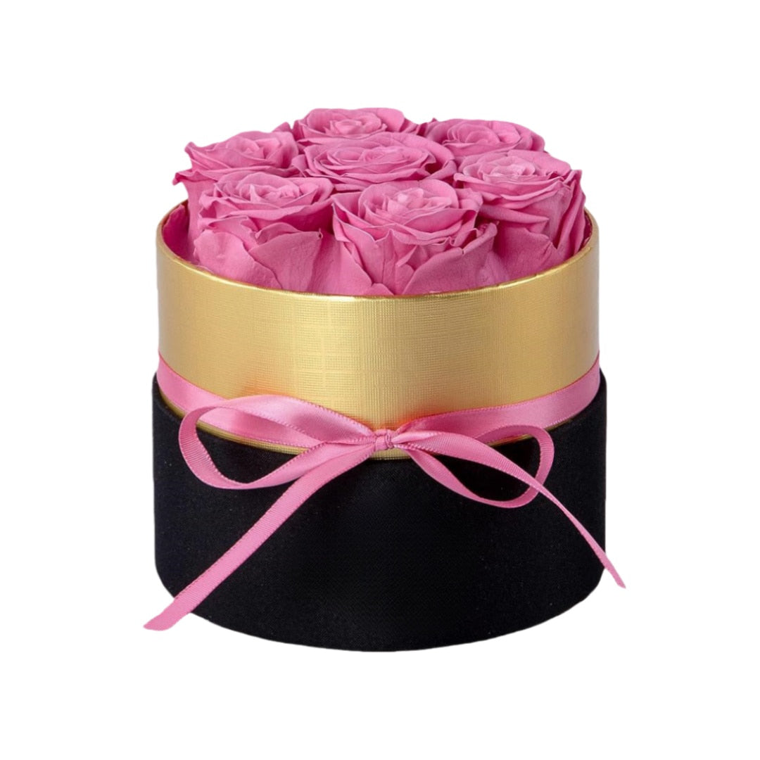 Design luxury 7 pink preserved roses in a black and gold box. Long lasting romantic gift.