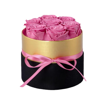 Design luxury 7 pink preserved roses in a black and gold box. Long lasting romantic gift.