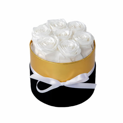 Design luxury 7 white preserved roses in a black and gold box. Long lasting romantic gift.