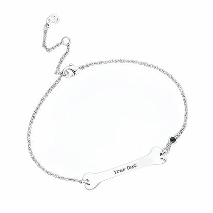 925 Sterling Silver personalized bone bracelet, flat lay product shot.