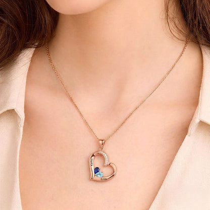Close up of woman wearing custom heart name pendant