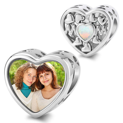 Personalized photo heart charm engraved with MOM and a central opal accent surrounded by small hearts.