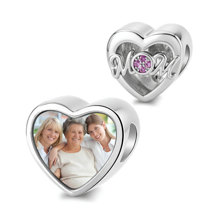 Personalized picture heart-shaped charm featuring script MOM text and pink stones.