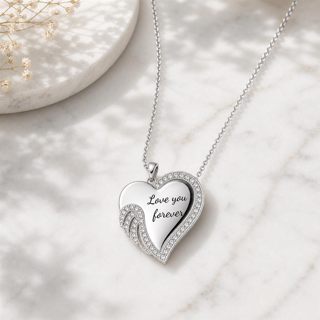 Angel wing heart necklace on marble