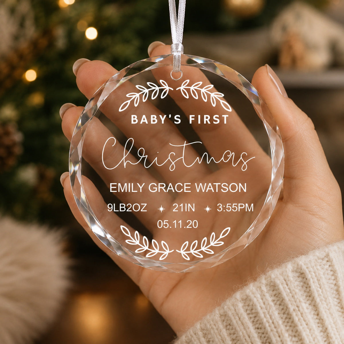Baby's First Christmas Birth Stats Design personalized glass ornament in hand scale view