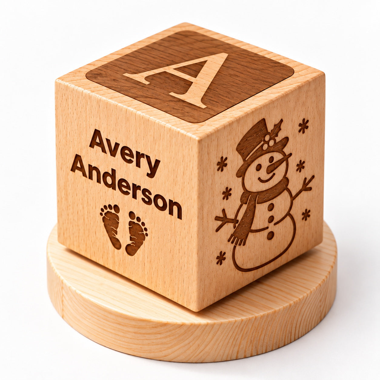 Personalized wooden baby keepsake cube with custom name, baby footprints, snowman engraving, and Baby's First Christmas design