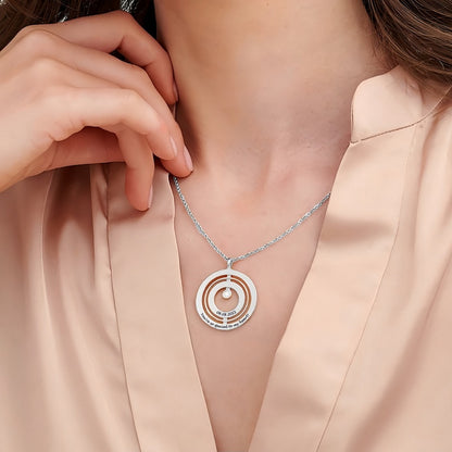 Round Spinning Pendant Necklace in silver worn by model. Shows size and engraving detail.