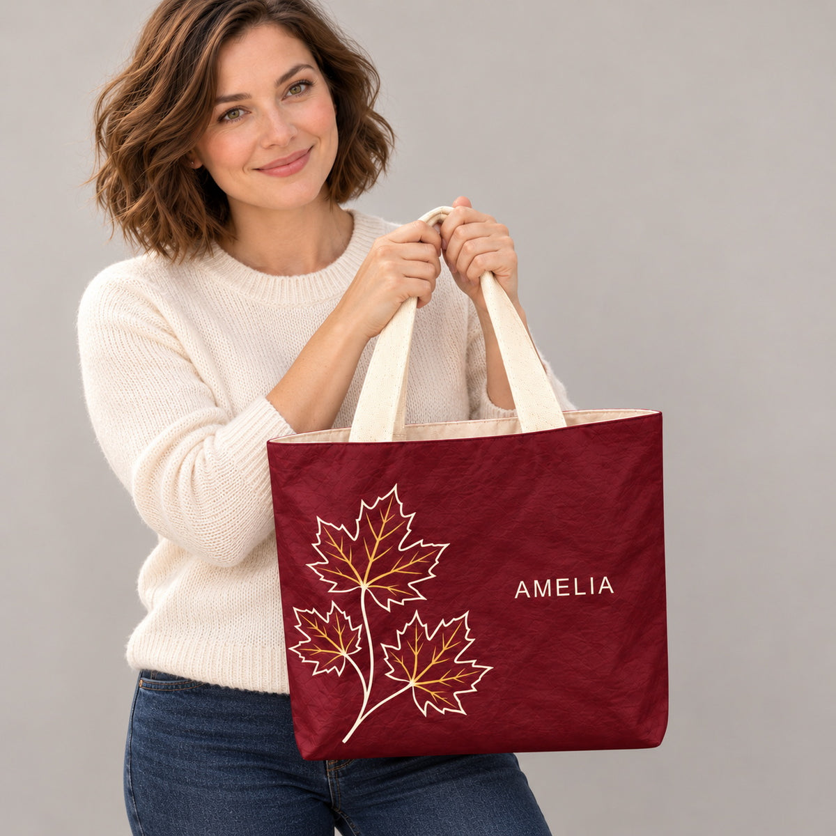 Personalized Burgundy Maple Leaf Tote Bag with Custom Name showing the custom name and botanical design detail
