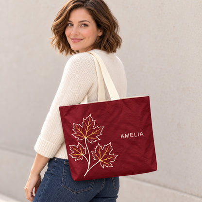 Personalized Burgundy Maple Leaf Tote Bag with Custom Name shown as an everyday shoulder carry look