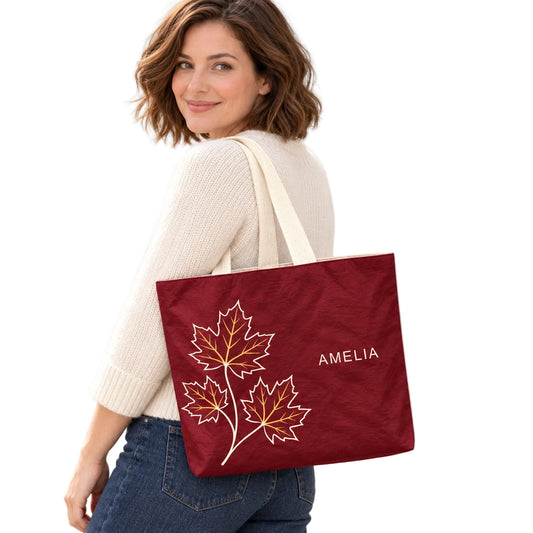 Personalized Burgundy Maple Leaf Tote Bag with Custom Name shown as an everyday shoulder carry look