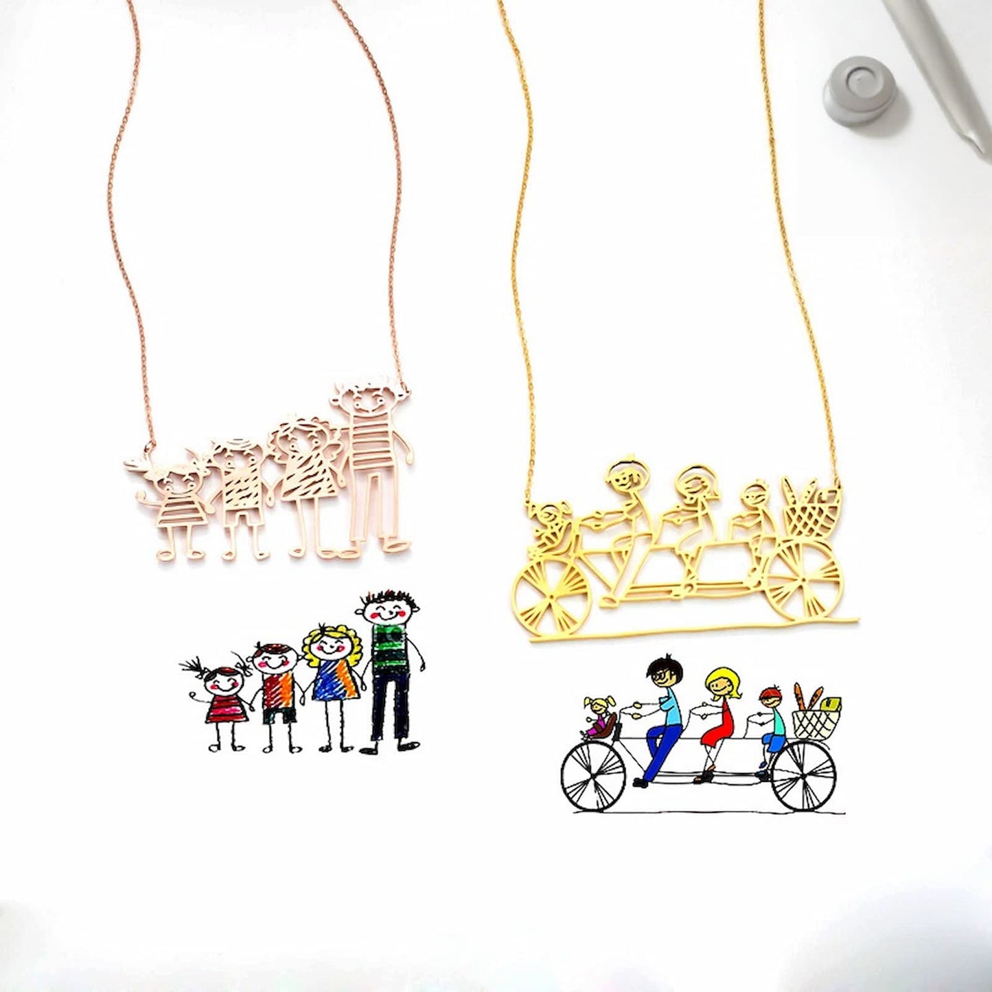 Personalized gold necklace featuring a custom outline of a family drawing