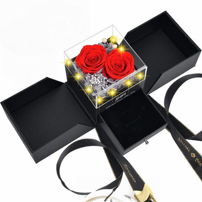 Classic red preserved roses in a black jewelry box with glowing LED lights.