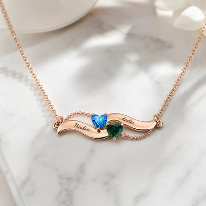 Angel wing birthstone necklace on marble