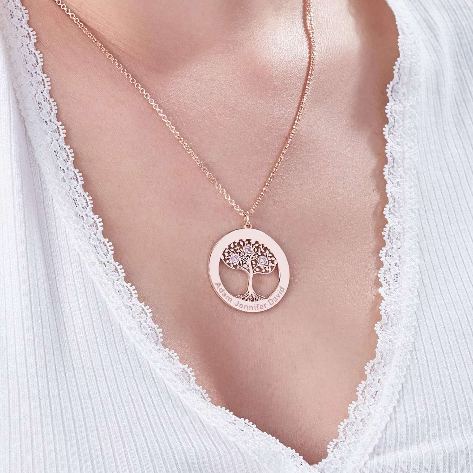 Custom Birthstone Family Necklace worn by a woman. Shows the elegant circle of life charm.