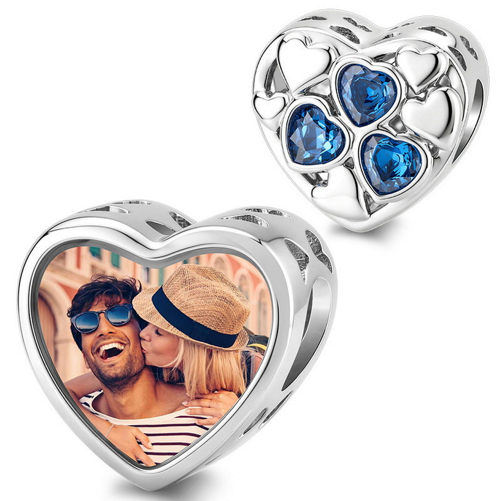 silver heart charm featuring blue sapphire heart-shaped crystals and a custom photo locket