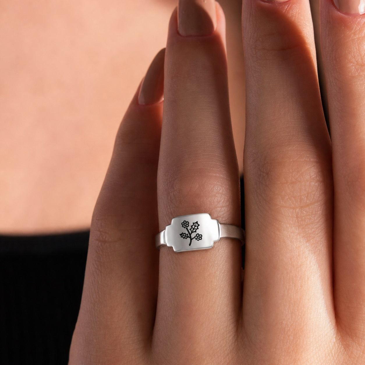 Custom botanical engraved wrap ring on hand