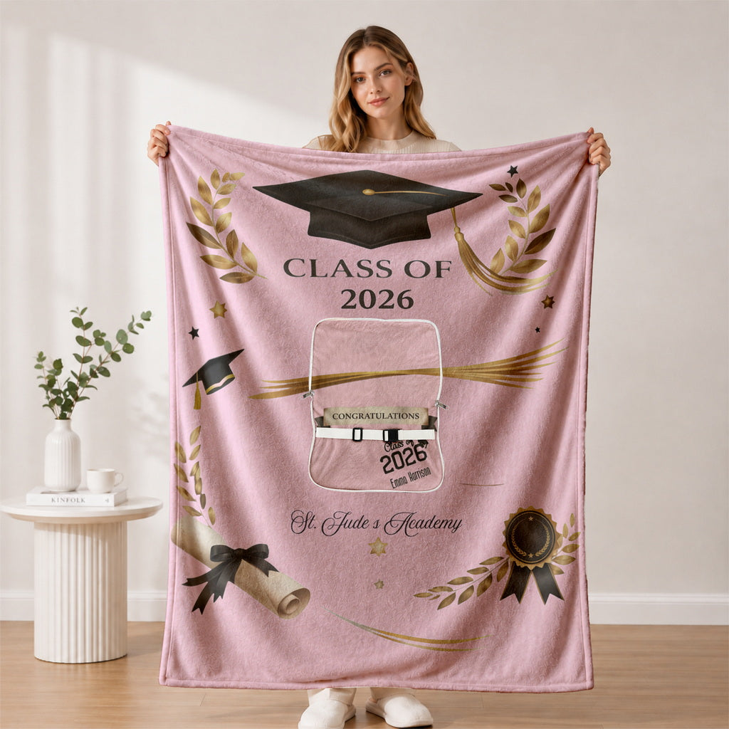 Woman holding open pink Class of 2026 personalized blanket.