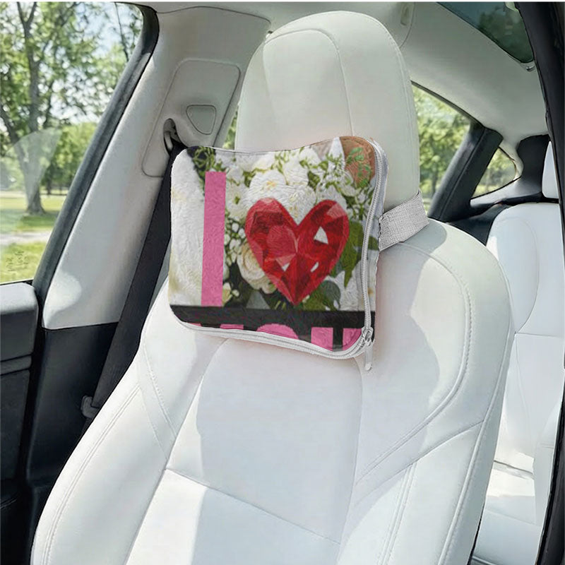 Custom photo heart pillow used as a car headrest.