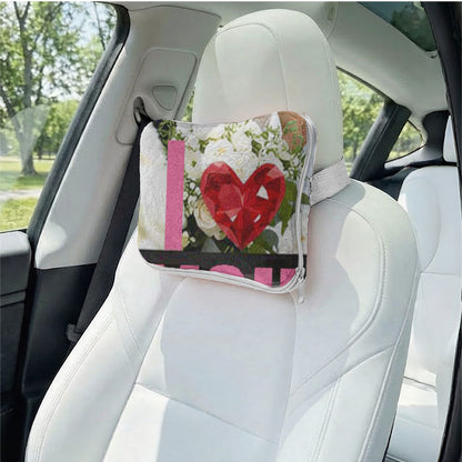 Custom photo heart pillow used as a car headrest.