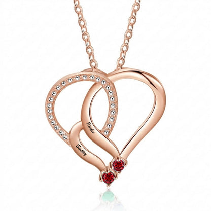 Rose gold double heart necklace with red birthstones.