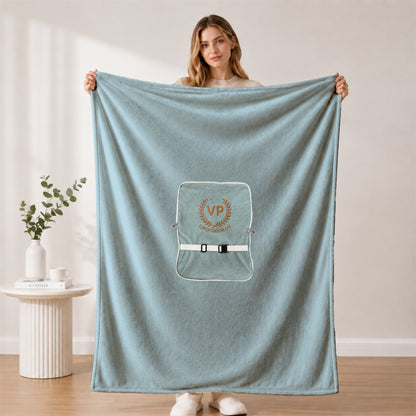 Large plush groomsman blanket held by a woman.