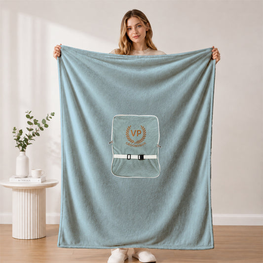 Large plush groomsman blanket held by a woman.