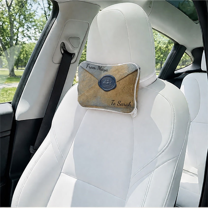 Envelope pillow used as a car seat headrest support.