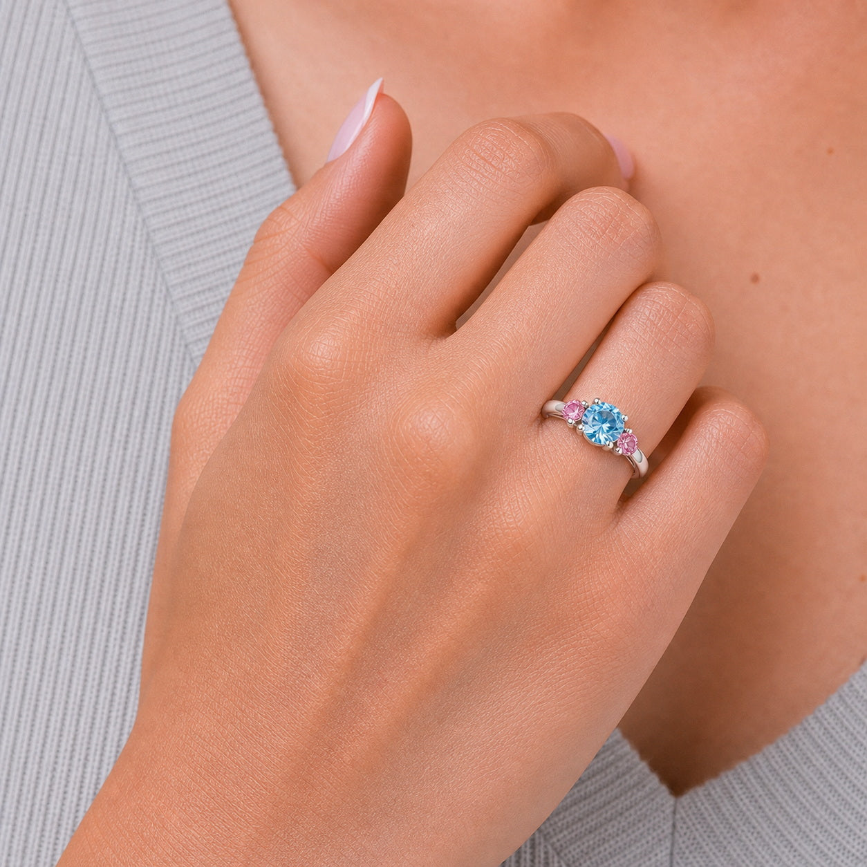 Custom family birthstone ring on hand