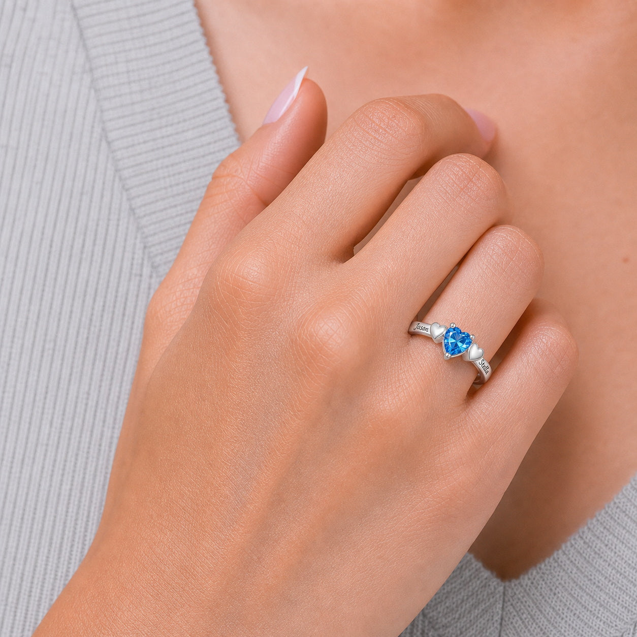 Custom heart solitaire name ring on hand