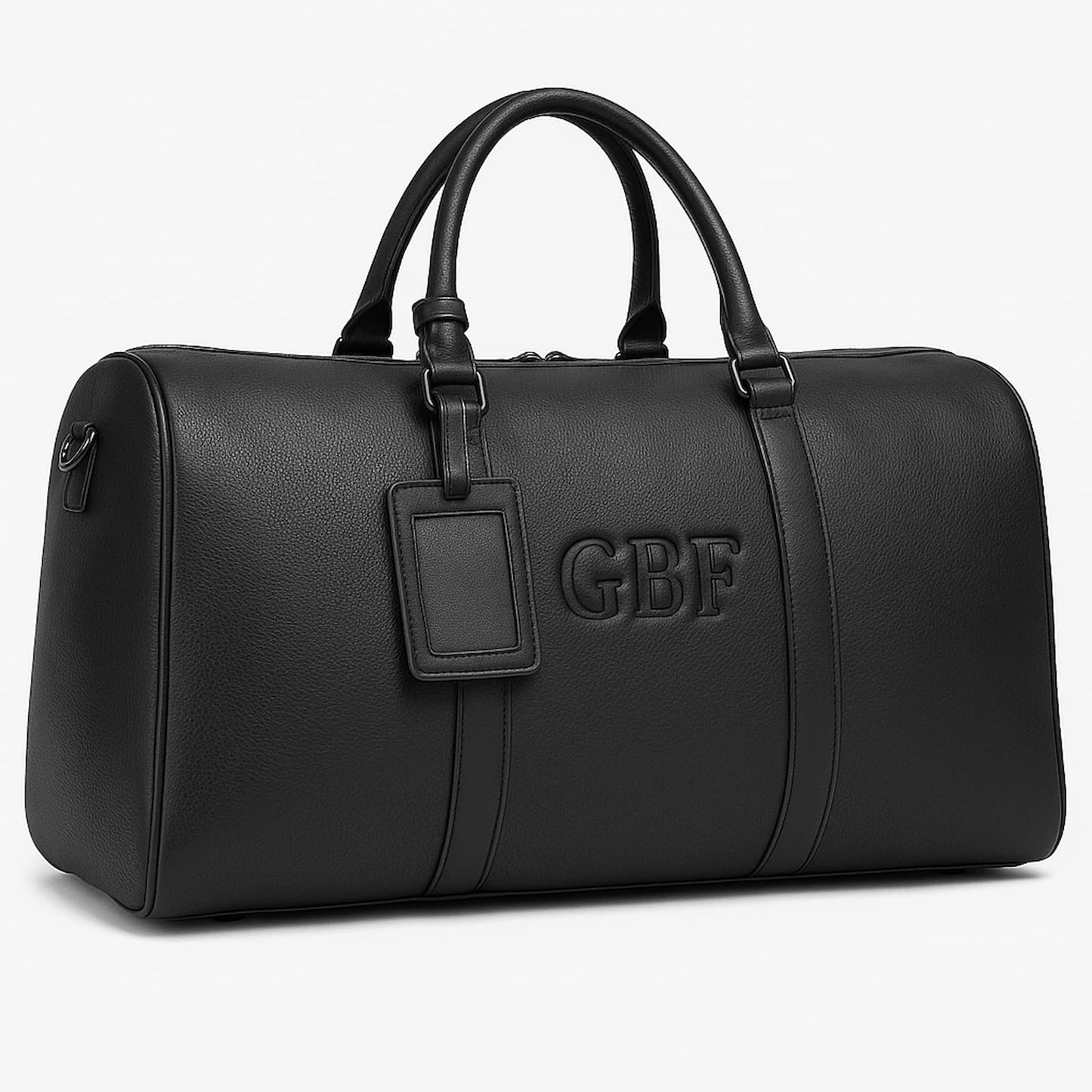 Close-up of the custom embossed monogram on a large black leather travel or gym bag.