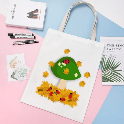 Custom monogrammed canvas shopping bag showing durable shoulder strap.