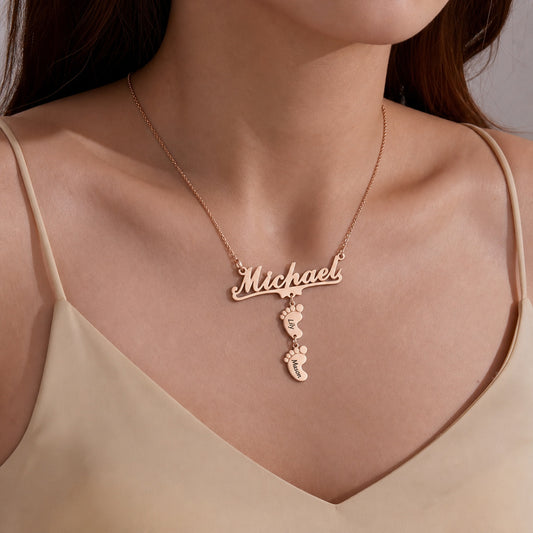 Woman wearing a name baby feet necklace