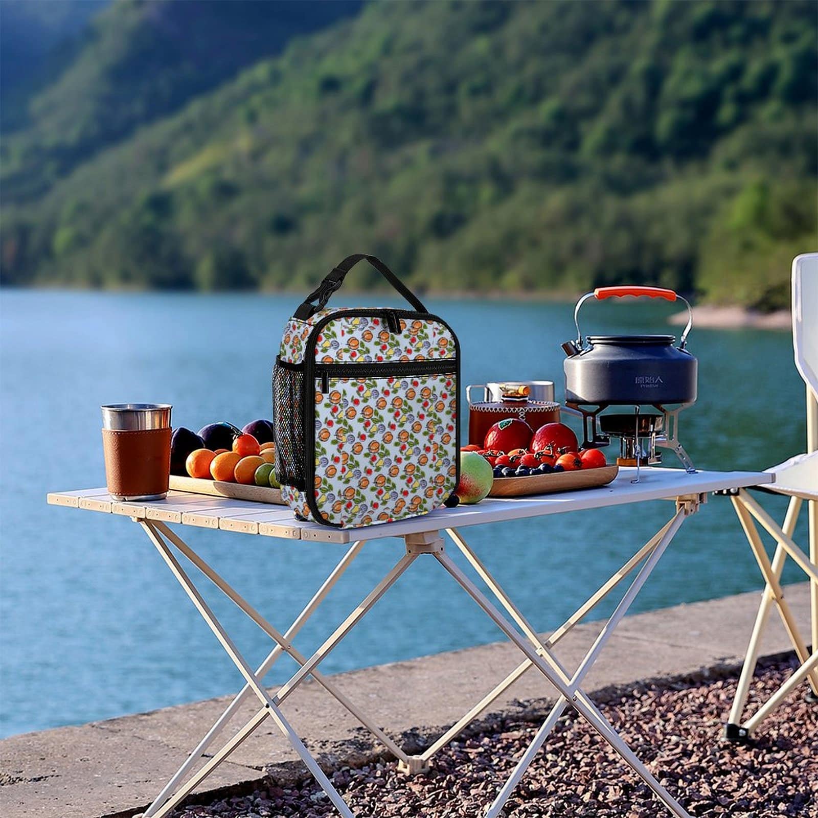 Custom Office Lunch Bag shown on an outdoor table setting by a lake.