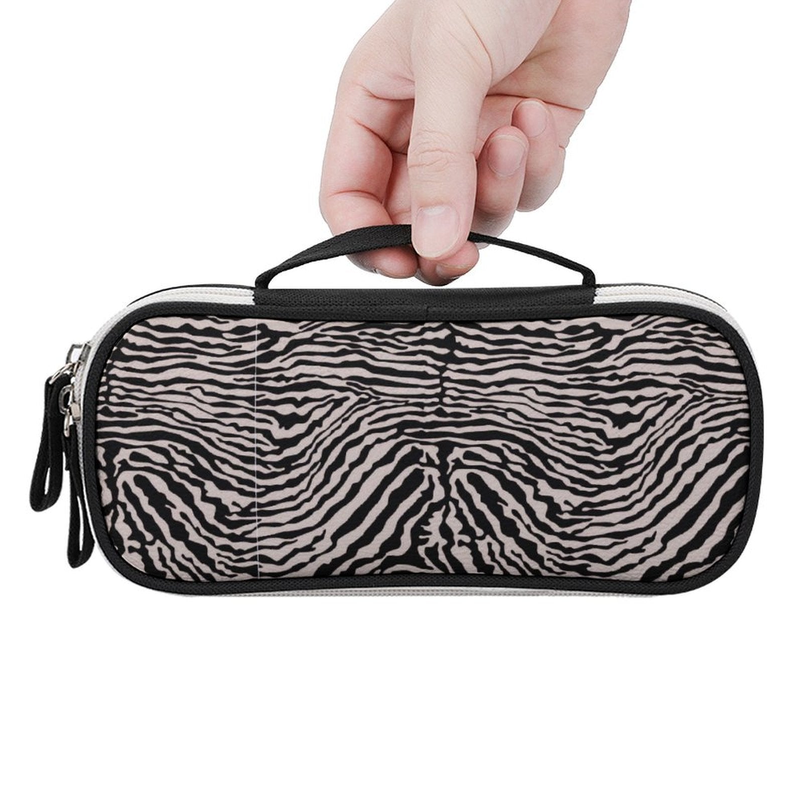 Hand holding custom zebra print pencil bag with a sturdy black carrying handle.