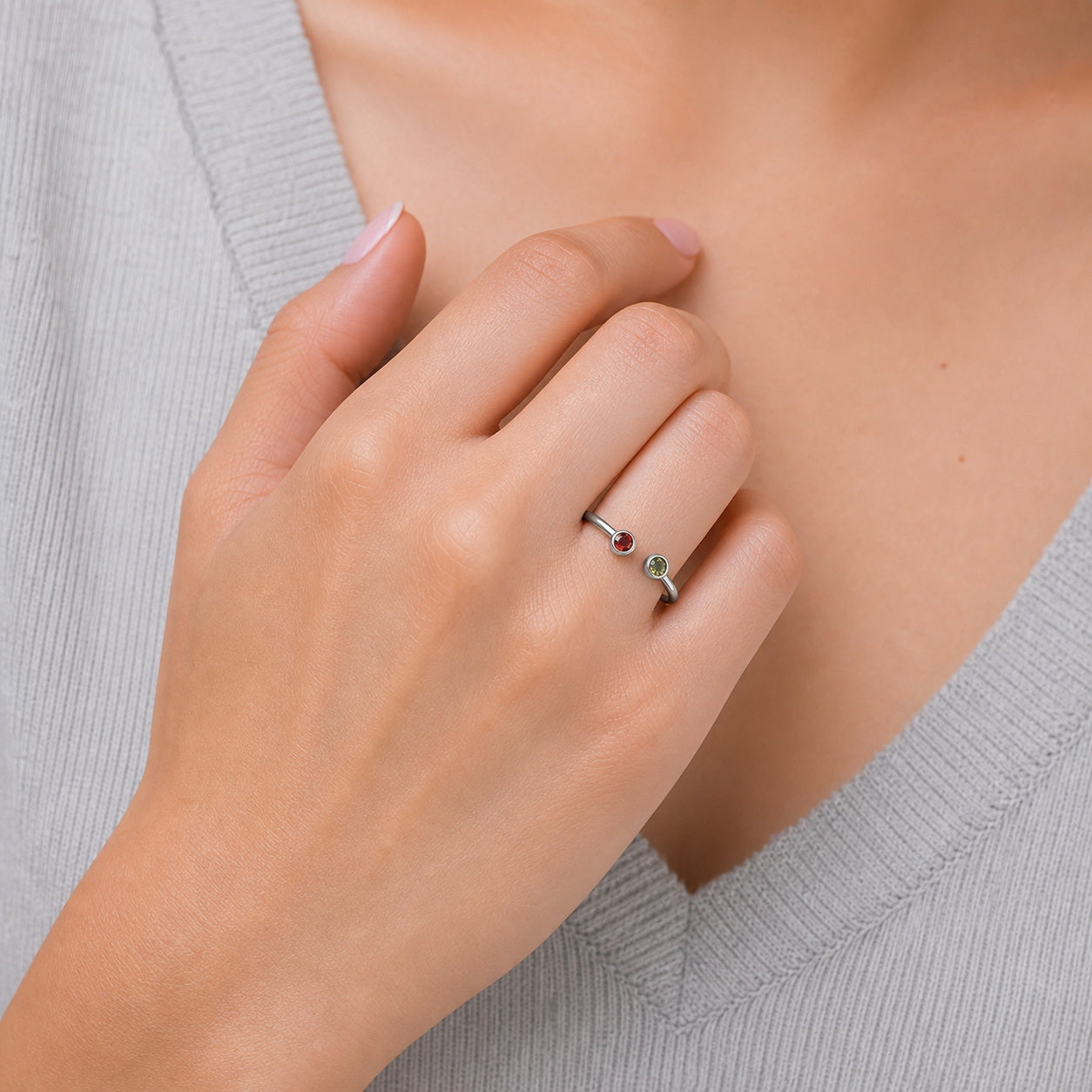 Custom two birthstone open ring on hand